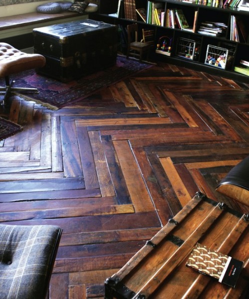 Shipping pallet flooring can be laid in various patterns such as this herringbone design.
